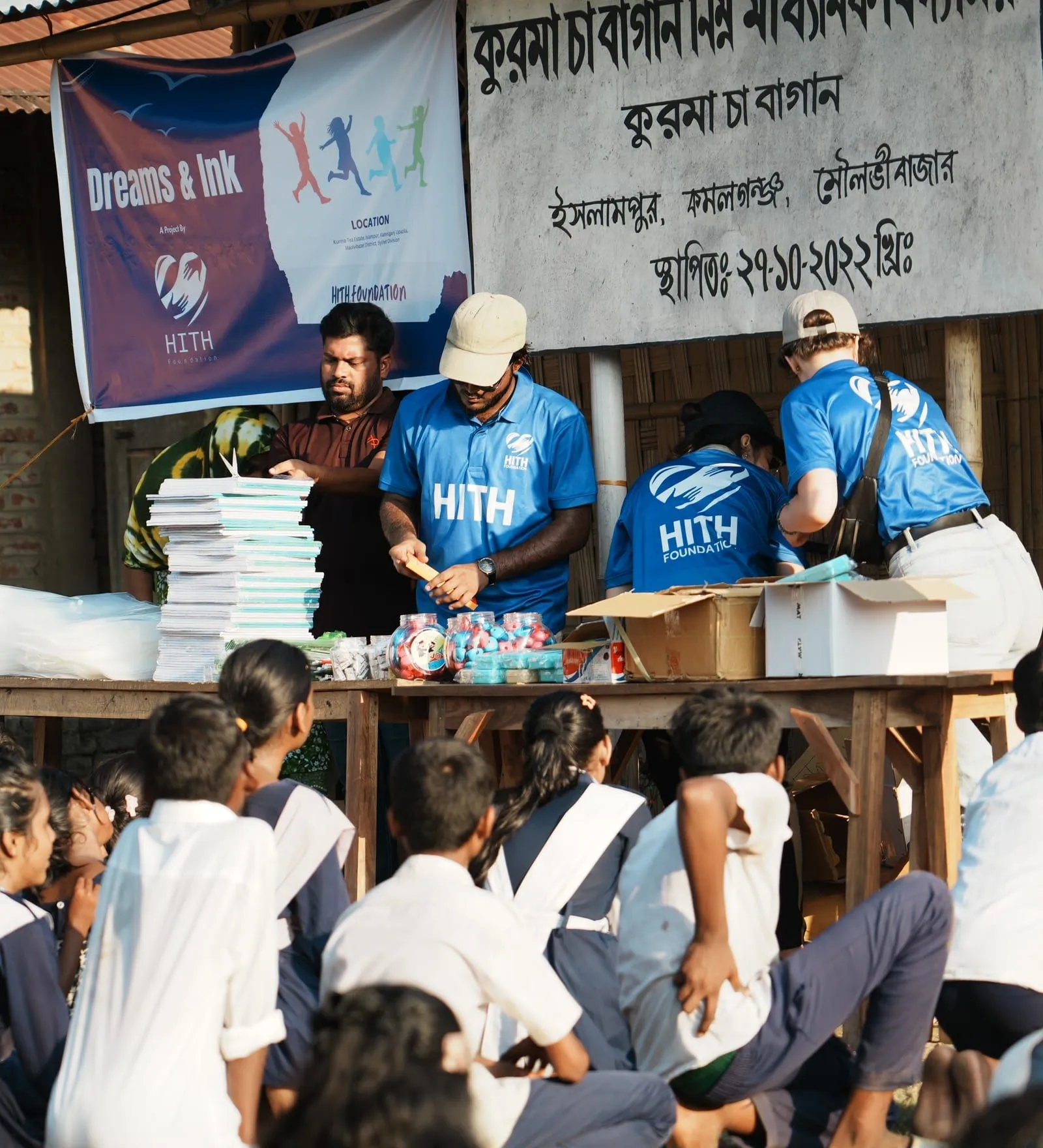 HITH volunteers preparing supply kits at the Dreams & Ink distribution, Kurma Tea Garden school