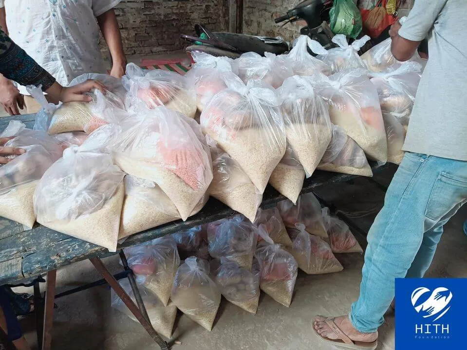 Food packages distribution at 25, Moddho Bashabo, Dhaka