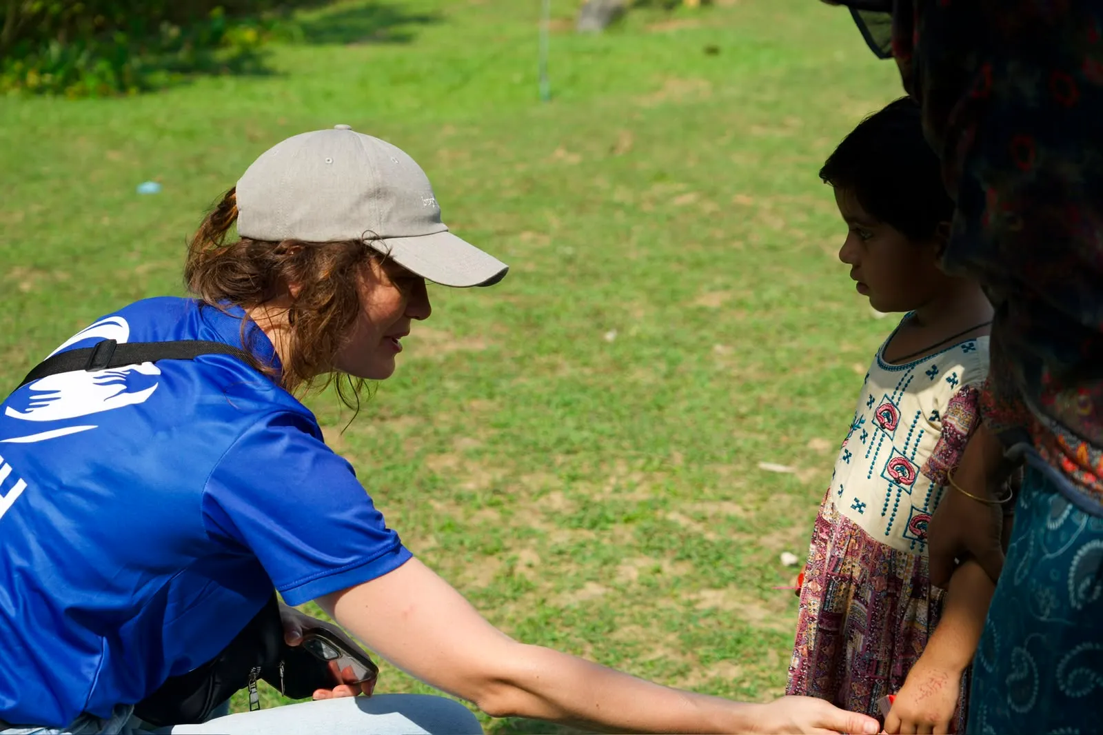 A HITH volunteer meeting a tea garden child eye to eye